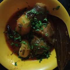 A picture of Cabbage stuffed in potato and brinjal.