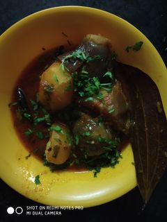 A picture of Cabbage stuffed in potato and brinjal.