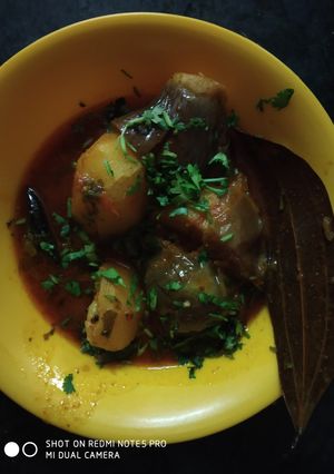 A picture of Cabbage stuffed in potato and brinjal.