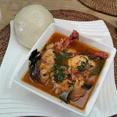 A picture of Utazi soup with fufu.