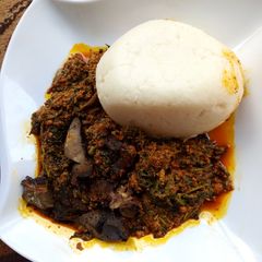 A picture of Tuwon shinkafa with egusi soup.