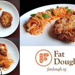 A picture of Chicken Parmesan + Spaghetti.