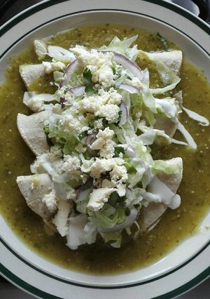 A picture of Quesadillas Dipped in Green Salsa.