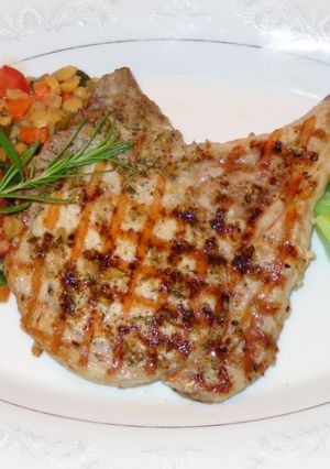 Una foto de Chuletas a la plancha con zeste de limón y romero