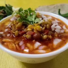 A picture of Moong and chana sprouts curry.