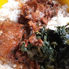 A picture of Rice with vegetable stew.