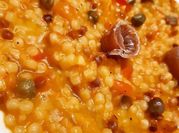Una foto di fregola con pesce