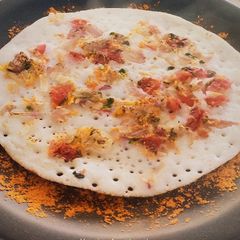 Tomato Onion Uttappam A picture of Tomato Onion Uttappam.