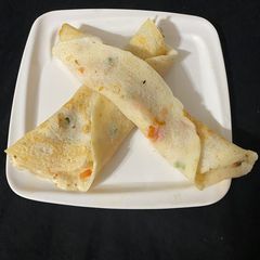 A picture of Tomato Onion Uttapa.