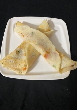 A picture of Tomato Onion Uttapa.