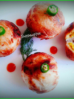 A picture of Bread kachori with leftover daal.