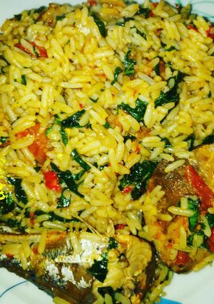 A picture of My emergency jollof rice with pumpkin/ugu leaf.