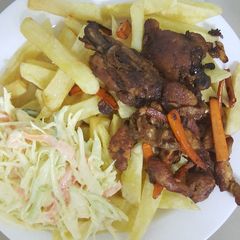 A picture of Homemade Fries With Fried Carrot Chicken and Coleslaw.