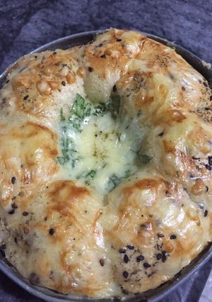 A picture of Buns with spinach cheese dip.