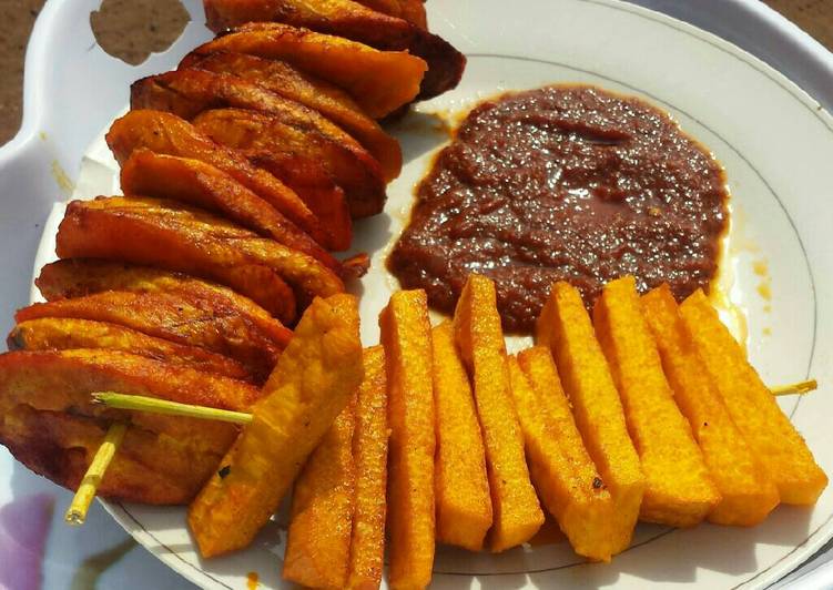 Palm oil fried yam,plantain with tomatoes sauce
