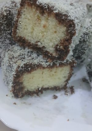 صورة لوصفة كيك مغطى بجوزالهند والشوكولاتة🥥🍫