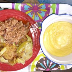 A picture of Fried sweet potatoes with fried eggs and yellow pap.