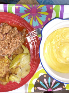 A picture of Fried sweet potatoes with fried eggs and yellow pap.