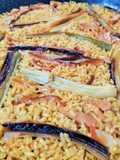 Arroz con calçots y magreta adobada