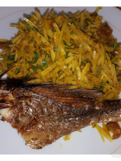 A picture of Abacha and grilled croaker.