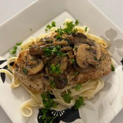 A picture of Mushroom Chicken on Fettuccine.