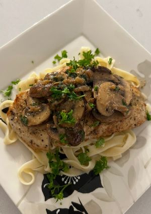 A picture of Mushroom Chicken on Fettuccine.
