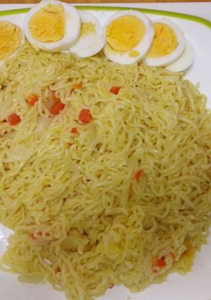 A picture of Noodles with cooked eggs.