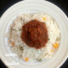 A picture of Veggies rice and tomatoes stew.