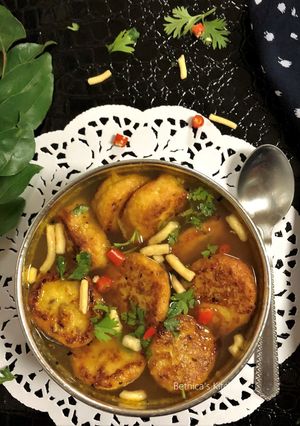 A picture of Tomato Rasam Vada.