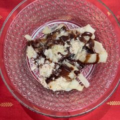 A picture of Rice flour Upma with nuts and sauce.