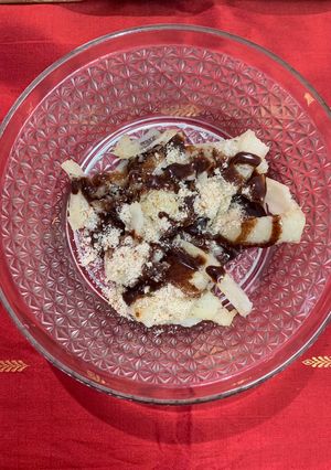 A picture of Rice flour Upma with nuts and sauce.