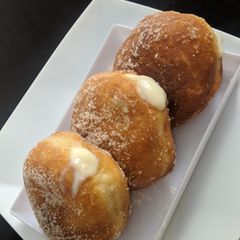 A picture of Vanilla cream filled doughnuts.