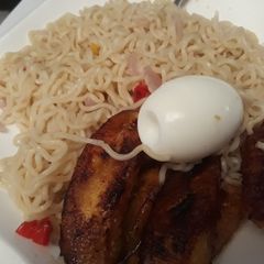 A picture of Indomine with fried plantain and egg.