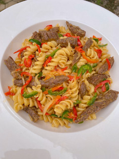 A picture of Stir fried beef pasta.