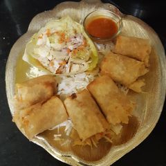 Spring rolls with kimchi salad and schezwan sauce dip A picture of Spring rolls with kimchi salad and schezwan sauce dip.