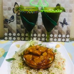 A picture of Sweet and sour chicken with egg fried rice(chinese dish) and mint mojito(drink).
