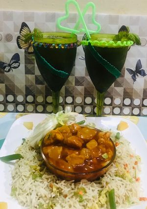 A picture of Sweet and sour chicken with egg fried rice(chinese dish) and mint mojito(drink).