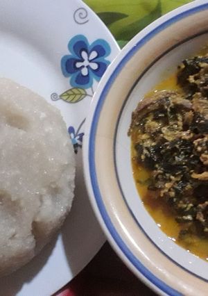 A picture of Egusi soup with scent leaf and uzuza seed.