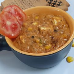 A picture of Corn paneer masala Curry.