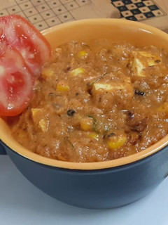 A picture of Corn paneer masala Curry.