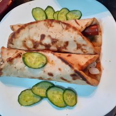 A picture of Chicken Ball n sausage Pita roll.