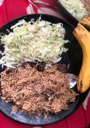 A picture of Beef pilau and steamed cabbages.