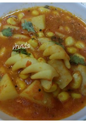 A picture of Aloo Corn Pasta in red gravy.