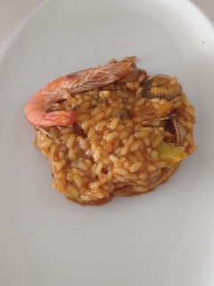 Una foto de Arroz meloso de berberechos y langostinos