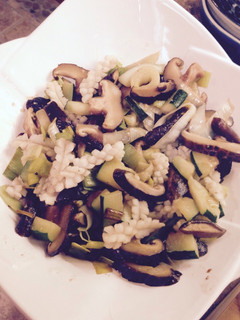A picture of Squid and mushroom stir fry.