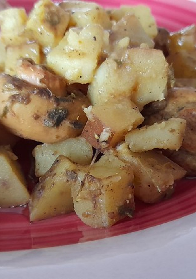 Una foto de Papas con champiñones especiados en leche de coco