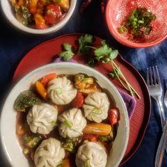 Chicken momos with spicy honey vegetables A picture of Chicken momos with spicy honey vegetables.