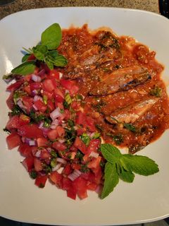 A picture of Sardines in Tomato Sauce with Pico de Gallo Salsa.