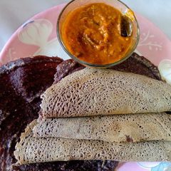 A picture of Healthy Raagi Dosa with spicy Tomato chutney.