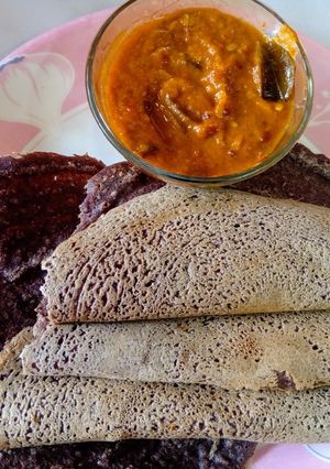 A picture of Healthy Raagi Dosa with spicy Tomato chutney.